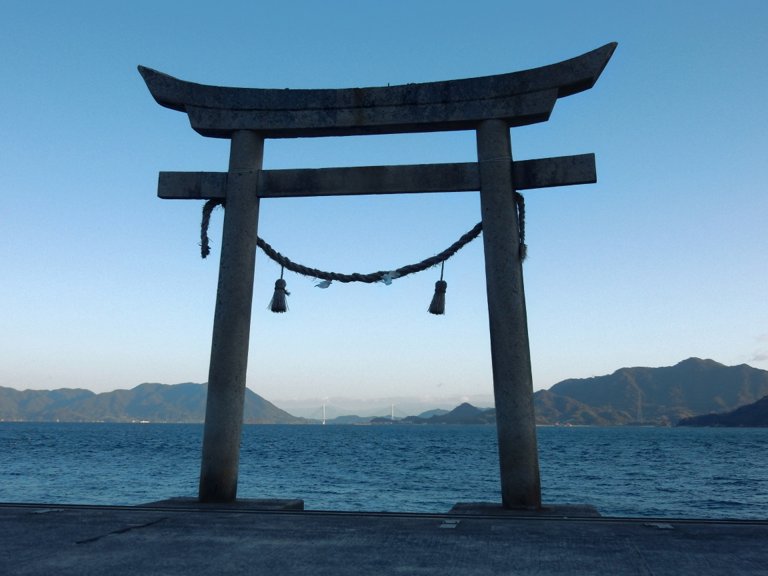 View of Seto Inland Sea through shrine gate in Tadanoumi